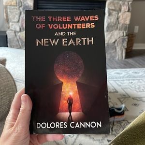 Used book the Three Waves of Volunteers and The New Earth by Delores Cannon